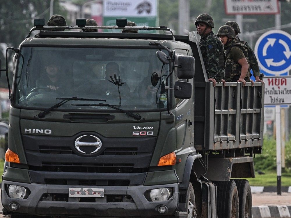  Royal Thai Army soldiers are transported on the back of an army truck in the Thai border province of Si Sa Ket on July 26, 2025.