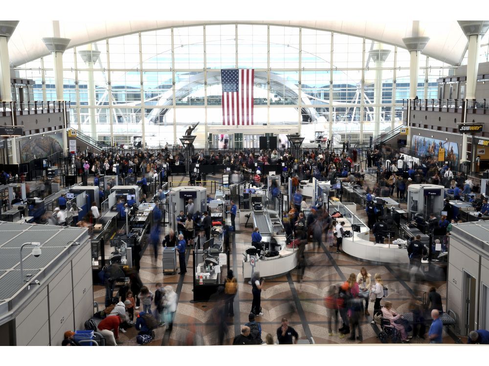 NextImg:'A big bang and a pop': Passengers use emergency slide to flee smoking plane at Denver airport