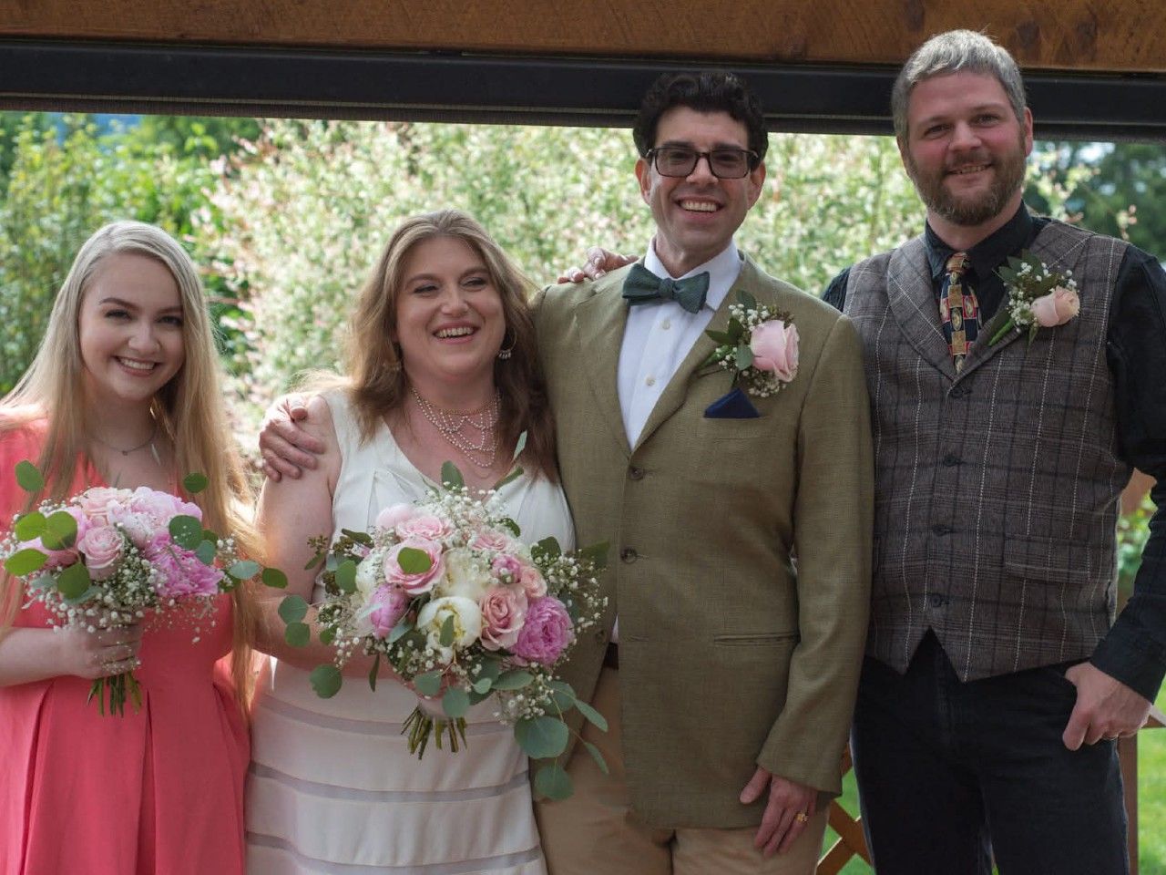  Andrea Nelson, second from the left, and James Baker-Taylor, second from the right, on their wedding day in 2024.