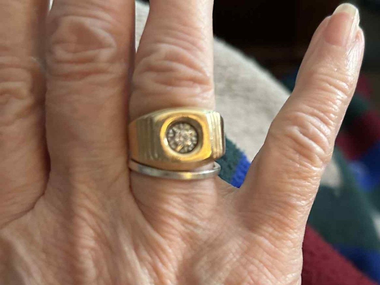 A Nanaimo couple say it's unfair they must pay nearly $200 in import fees to reclaim a family heirloom wedding ring mistakenly left behind in the U.S. and shipped to them. A relative in Washington State sent them this photo afterward to confirm they had found it. 