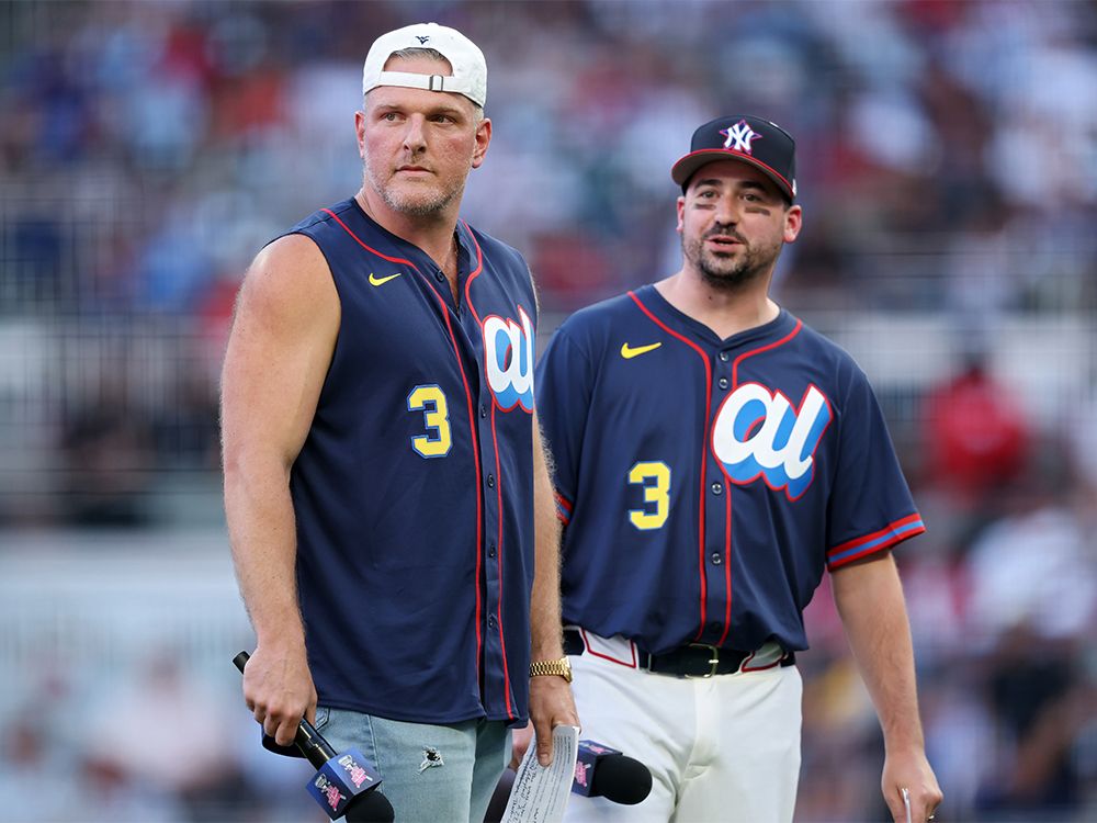 Sports analyst Pat McAfee, left, and Ty Schmit, producer and on-air personality for McAfee’s sports talk show, introduce the participants in the MLB Home Run Derby in Atlanta, Ga., on July 14, 2025. Sports analyst Pat McAfee, left, and Ty Schmit, producer and on-air personality for McAfee’s sports talk show, introduce the participants in the MLB Home Run Derby in Atlanta, Ga., on July 14, 2025.