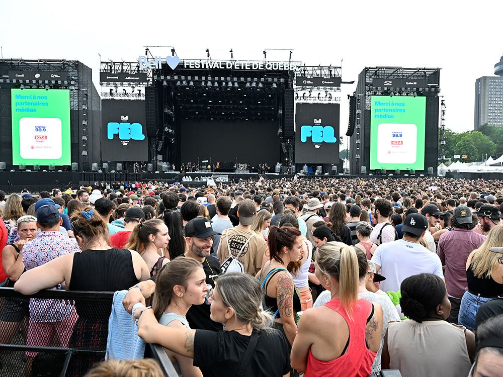 A crowd waits for an act to come on the main stage at the Festival d’été de Québec in 2023.