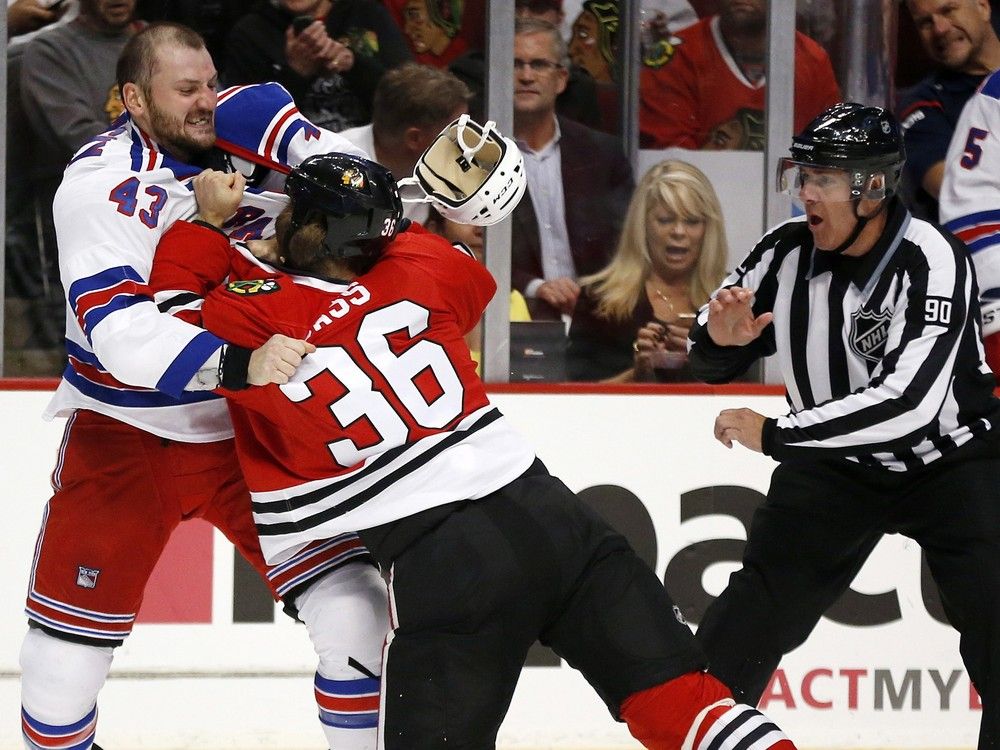  Nick Tarnasky, left, fights the Chicago Blackhawks’ Cody Bass during a 2014 pre-season game.