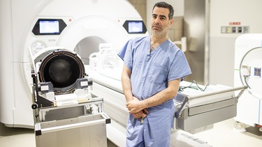 Dr. Nir Lipsman standing with a Focused Ultrasound Helmet at Sunnybrook Health Sciences Centre. Toronto, in June 2025.