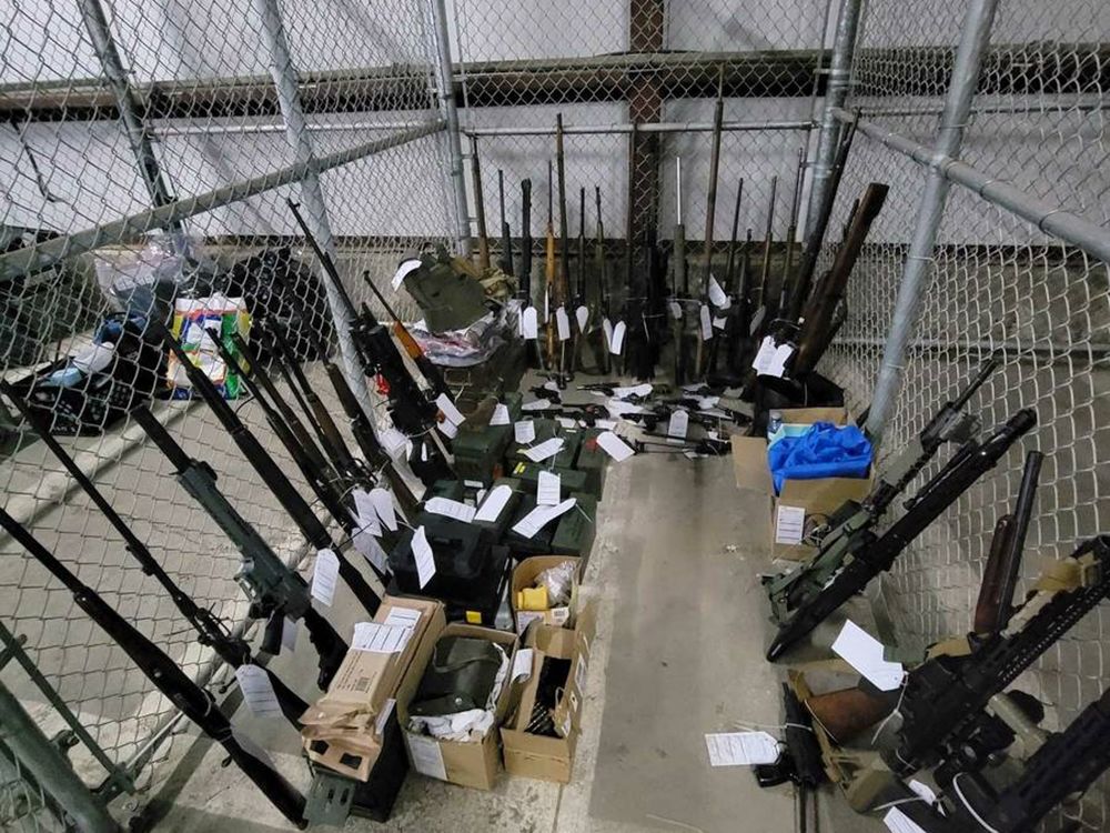 This photo shared by the RCMP shows military-style weapons seized during a search of an area in Quebec City.