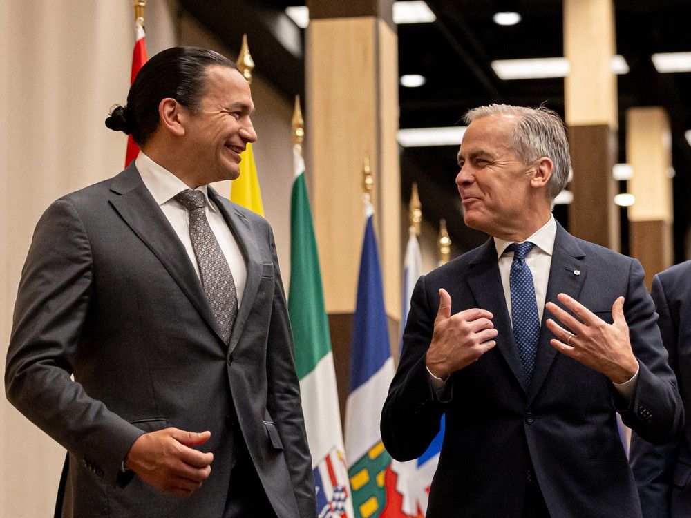 Manitoba Premier Wab Kinew and Prime Minister Mark Carey meet during the First Ministers' meeting in Saskatoon on Monday, June 2, 2025.