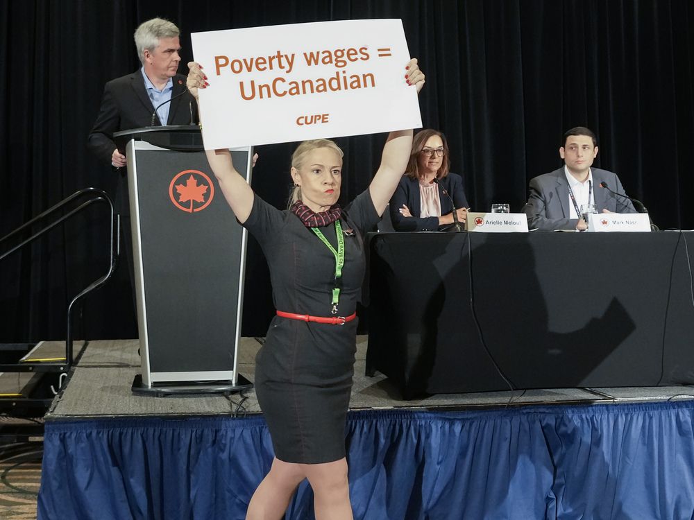 NextImg:Air Canada flight attendants disrupt company press conference, leading to its early conclusion