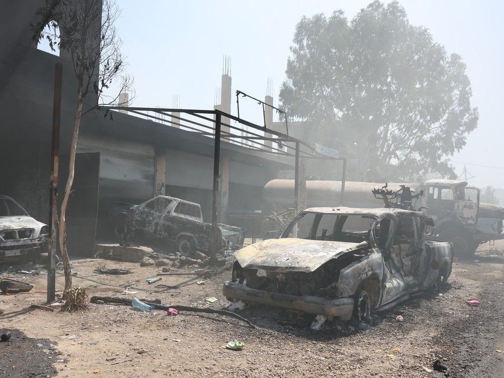  A burnt-out truck is seen on the streets on July 18, 2025 in Sweida, Syria. Fighting has flared up again between the Bedouin tribe and Druze sect in the southern Syrian province of Suwayda, as another ceasefire has collapsed a day after Syrian troops pulled out of the area.