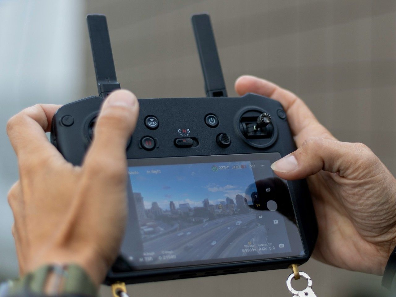  Airspace warnings from the drone are sent to the DJI RC Pro remote control held by the operator.