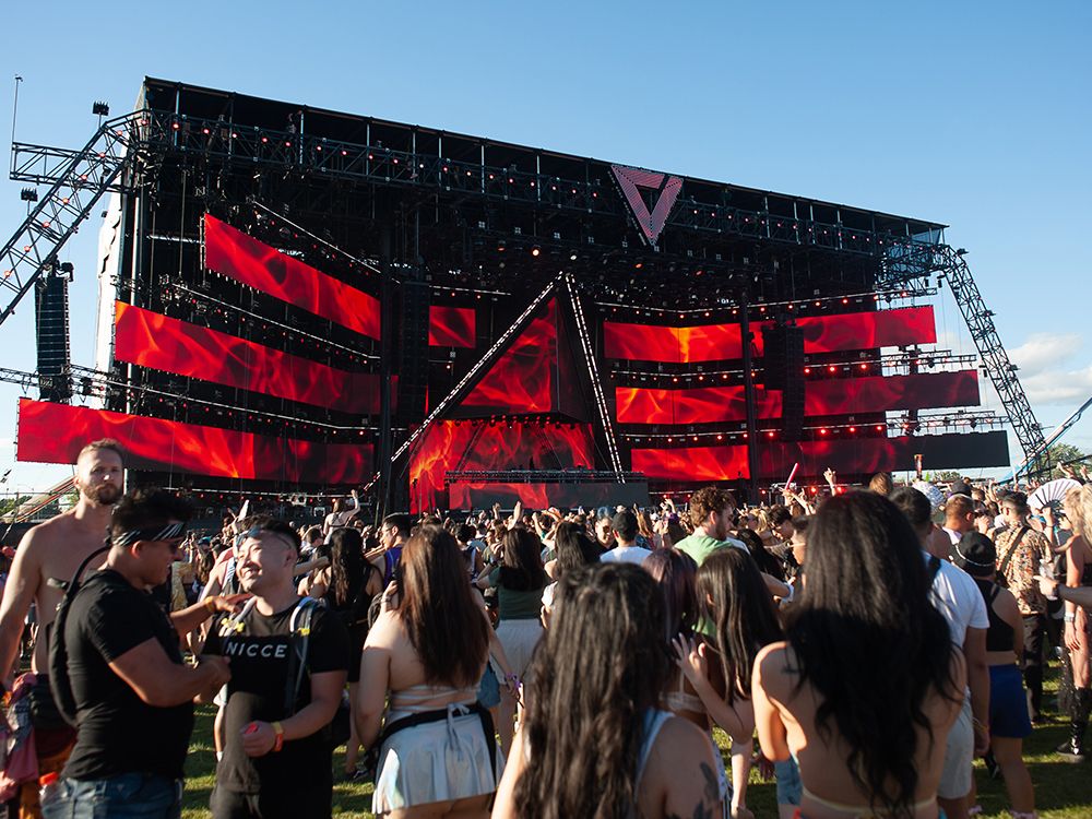 Electronic music fans attend a music festival in Downsview Park in Toronto.