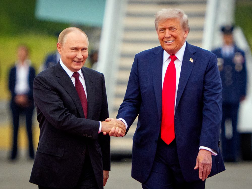 NextImg:Trump, Putin kick off Ukraine war summit in Alaska with smiles and warm handshake