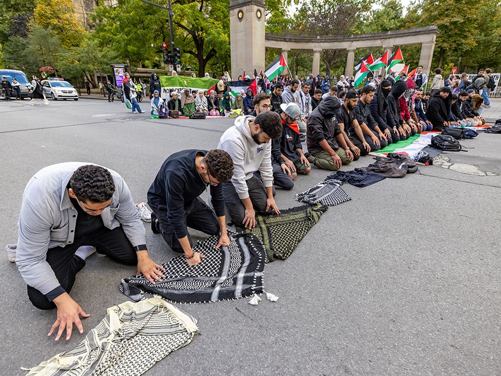 Muslims pray outside McGill University during an anti-Israel protest in Montreal on October 7, 2024 — the one year anniversary of the Hamas attack on Israel.  Muslims pray outside McGill University during an anti-Israel protest in Montreal on October 7, 2024 — the one year anniversary of the Hamas attack on Israel.
