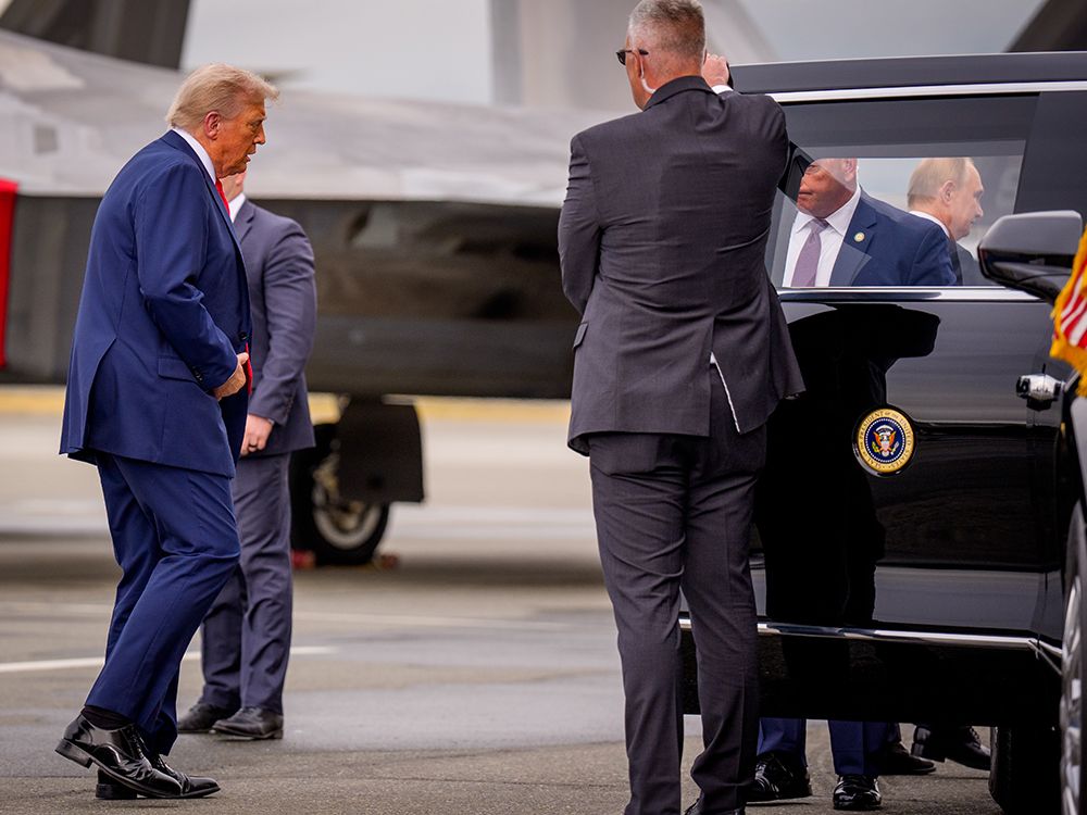 NextImg:Trump-Putin quickly grab alone time in limo before start of Ukraine summit