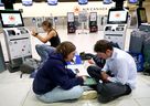 Air Canada passengers wait at the Calgary airport as the strike continues Monday.