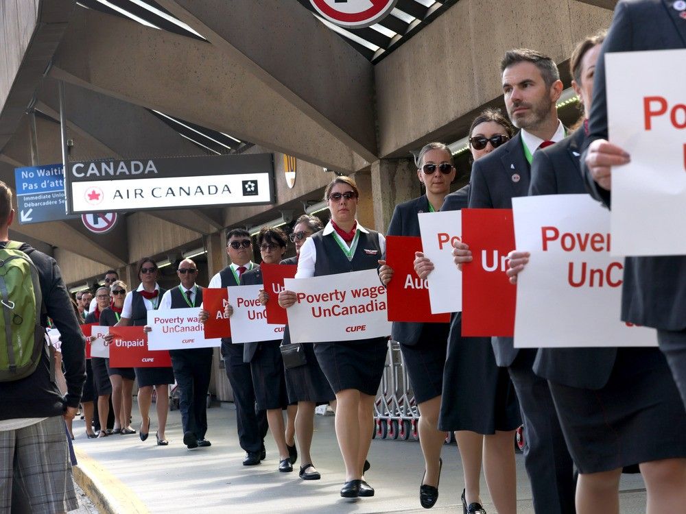  Air Canada flight attendants held actions at airports in Montreal, Toronto, Vancouver and Calgary (pictured) to raise awareness among Canadians about ongoing issues related to their working conditions on Monday, Aug. 11, 2025.