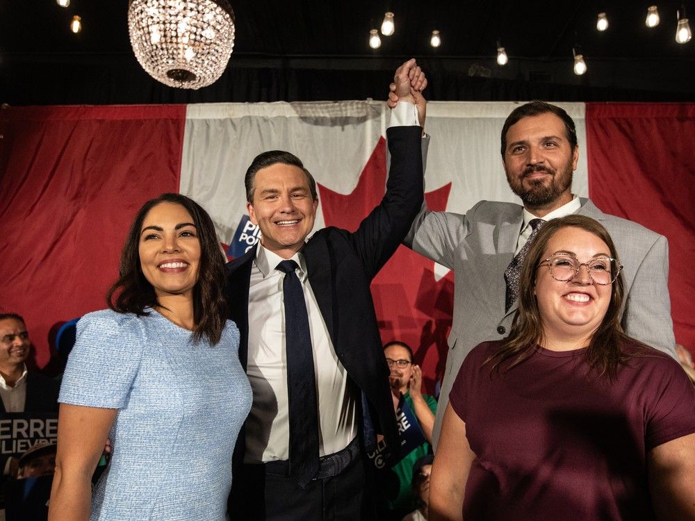  From left, Anaida Poilievre, Conservative Party Leader Pierre Poilievre, Damien Kurek and Danielle Kurek celebrate Conservative Party Leader Pierre Poilievre’s win during the Battle River-Crowfoot byelection in Camrose, Alta., Monday, Aug. 18, 2025.