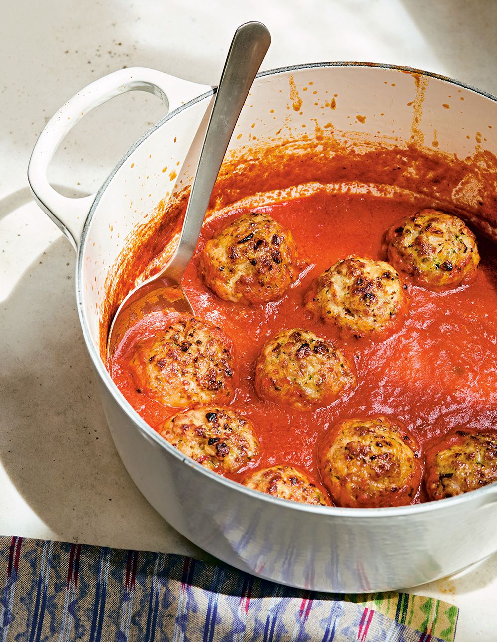  Samin Nosrat likes to serve her fluffy pork meatballs not on top of spaghetti but with olive oil-fried bread rubbed with garlic.