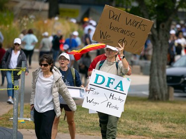 Protesters holding signs.