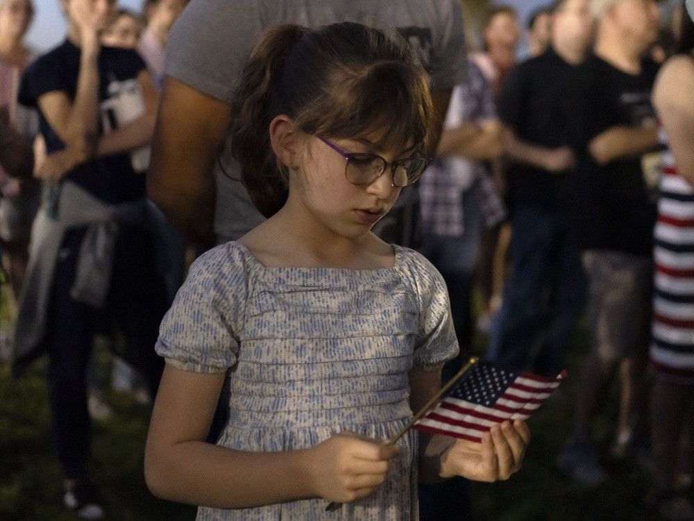 Arizonans mourn Turning Point USA Founder Charlie Kirk during a prayer vigil at Desert Horizon Park on September 10, 2025 in Scottsdale, Arizona.