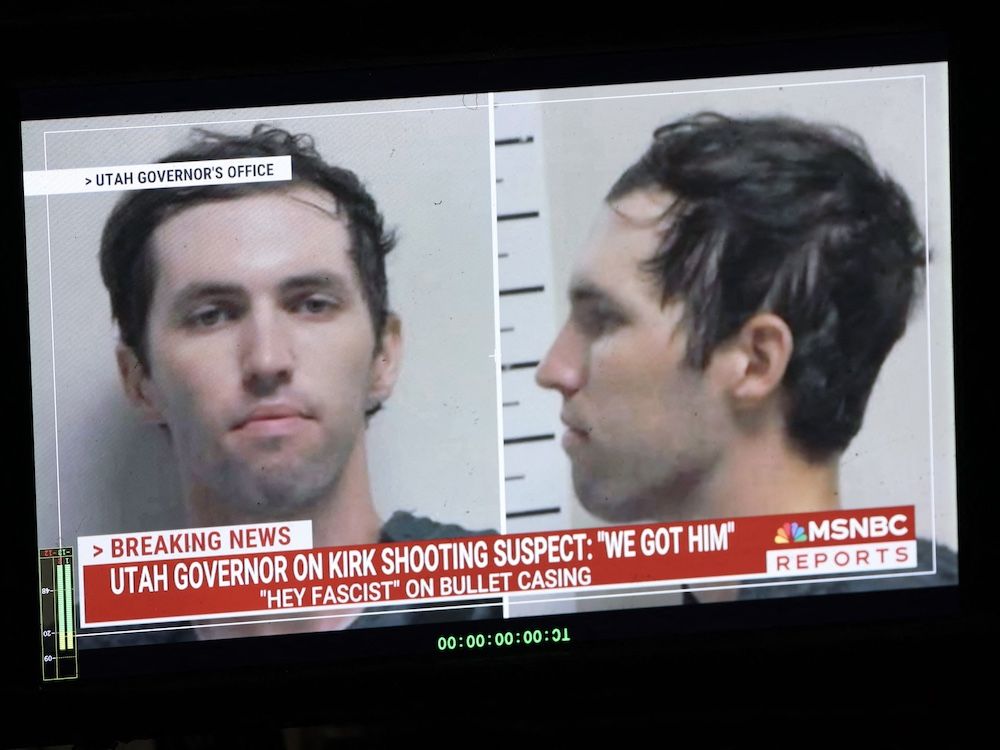 A TV monitor displays a picture of Tyler Robinson, the suspected of killing Charlie Kirk on September 11, in Orem, Utah, on September 12, 2025.  (Photo by PATRICK T. FALLON/AFP via Getty Images)