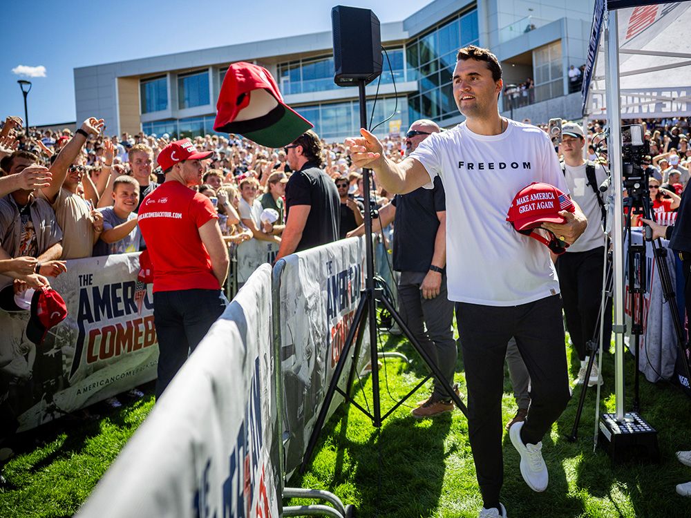  Charlie Kirk hands out hats before speaking at Utah Valley University in Orem, Utah, Wednesday, Sept. 10, 2025.