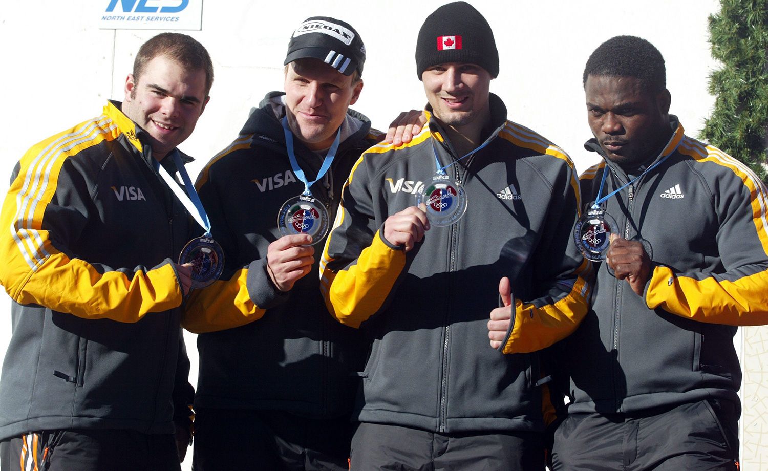 Four bobsledders.