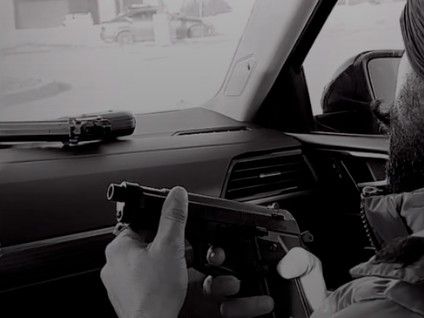  A screenshot from an online post of a person handling a gun from an account connected with several human smuggling ads. (Instagram)