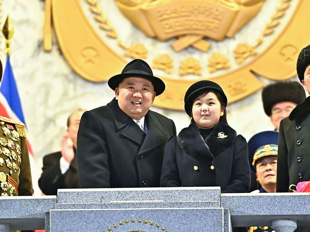  This picture taken on February 8, 2023 and released from North Korea’s official Korean Central News Agency (KCNA) on February 9, 2023 shows North Korea’s leader Kim Jong Un and his daughter presumed to be named Ju Ae attending a military parade celebrating the 75th anniversary of the founding of the Korean People’s Army.