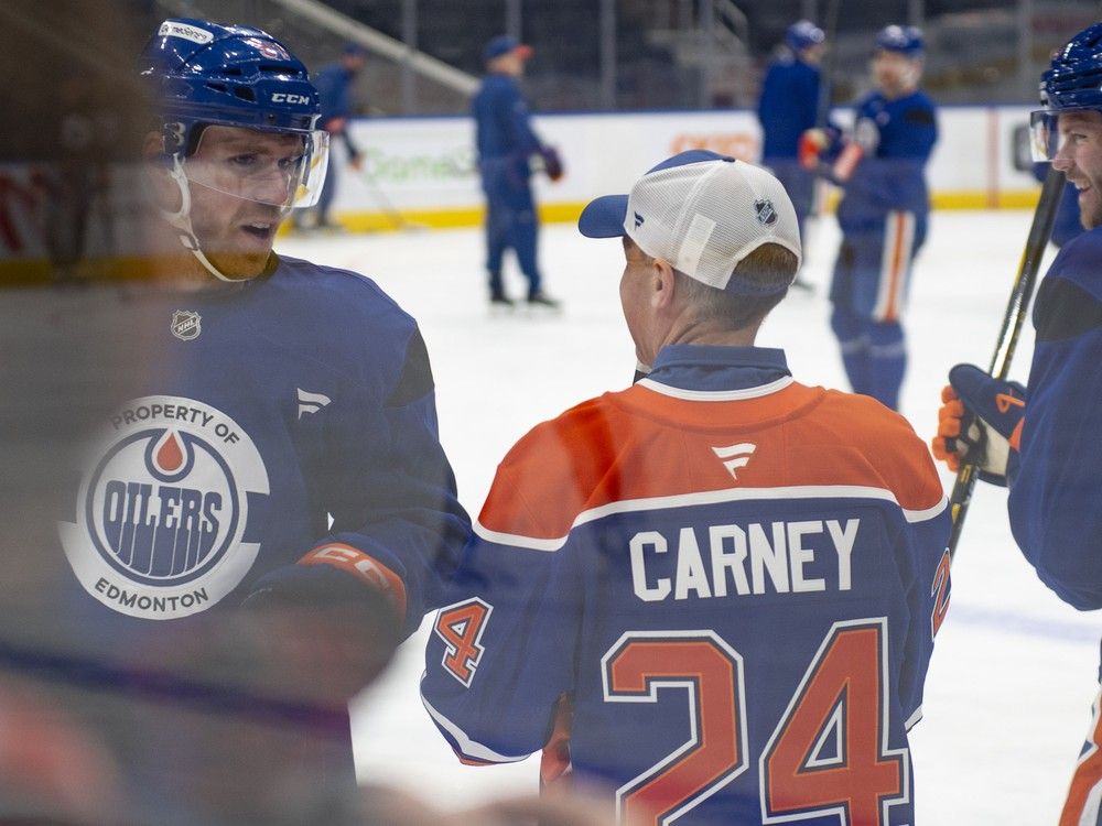 NextImg:Mark Carney says Connor McDavid unsigned is a crisis, jokes about helping him in the next budget
