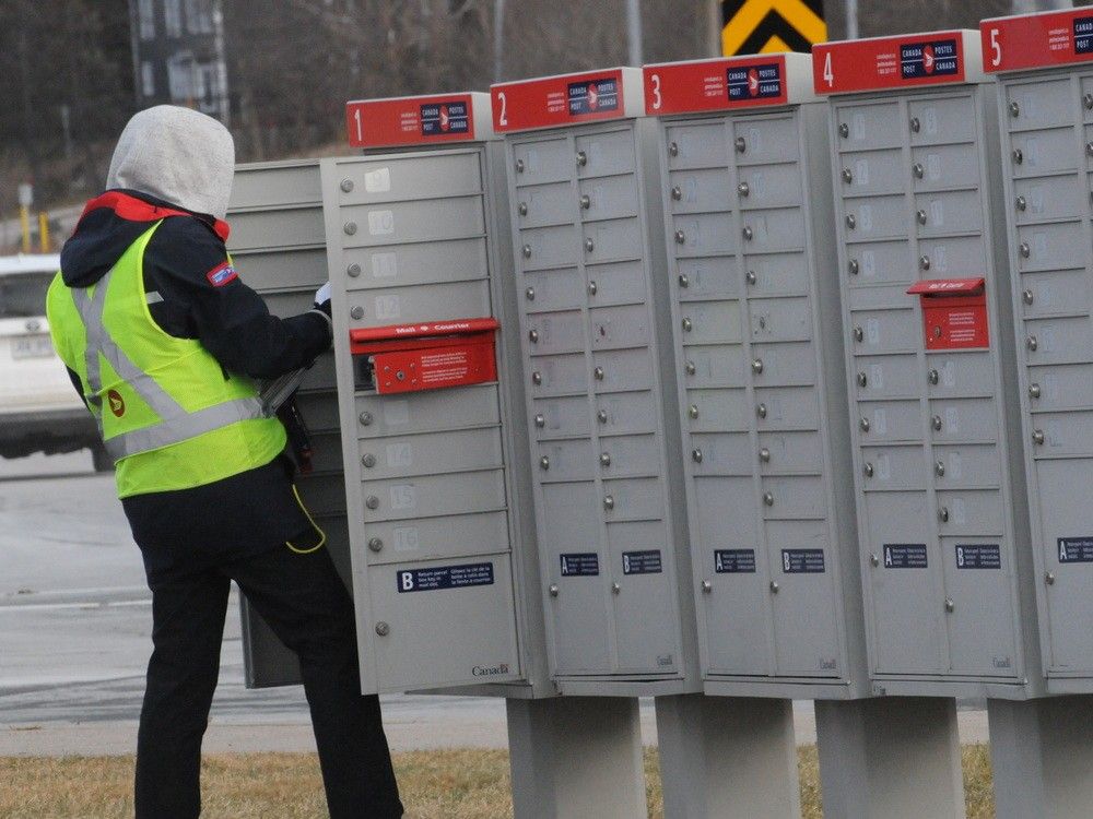 NextImg:Federal government announces end to door-to-door delivery for Canada Post