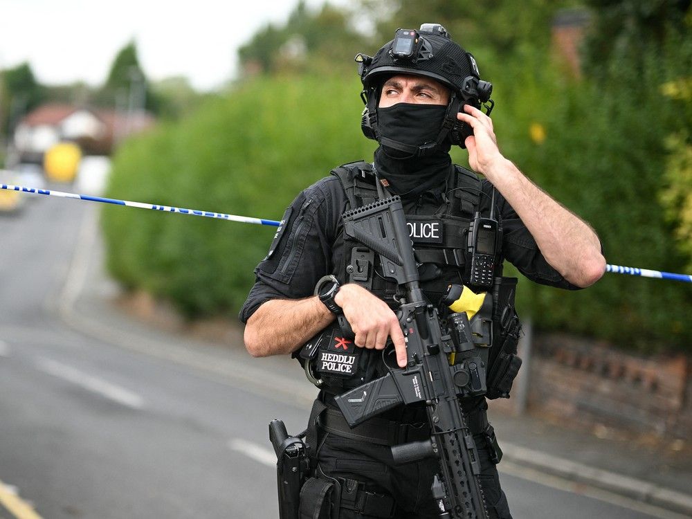 An armed police officer stands at a cordon on White House Avenue, near the Heaton Park Hebrew Congregation synagogue in Crumpsall, north Manchester, on Oct. 2, 2025, following an attack at the synagogue. An armed police officer stands at a cordon on White House Avenue, near the Heaton Park Hebrew Congregation synagogue in Crumpsall, north Manchester, on Oct. 2, 2025, following an attack at the synagogue.