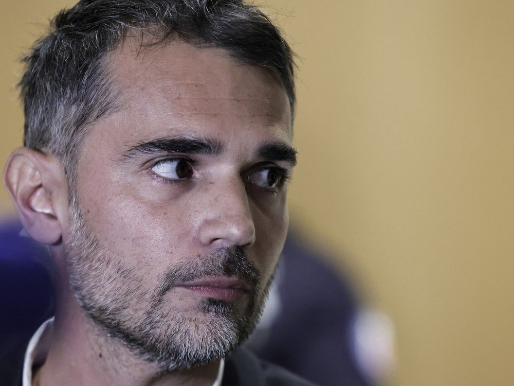  French author Aurélien Poirson-Atlan, also known as Zoe Sagan, speaks to the press during a break in his trial with nine other persons accused of sexist cyber-harassment of the wife of the French President, in Paris, on Oct. 28, 2025.