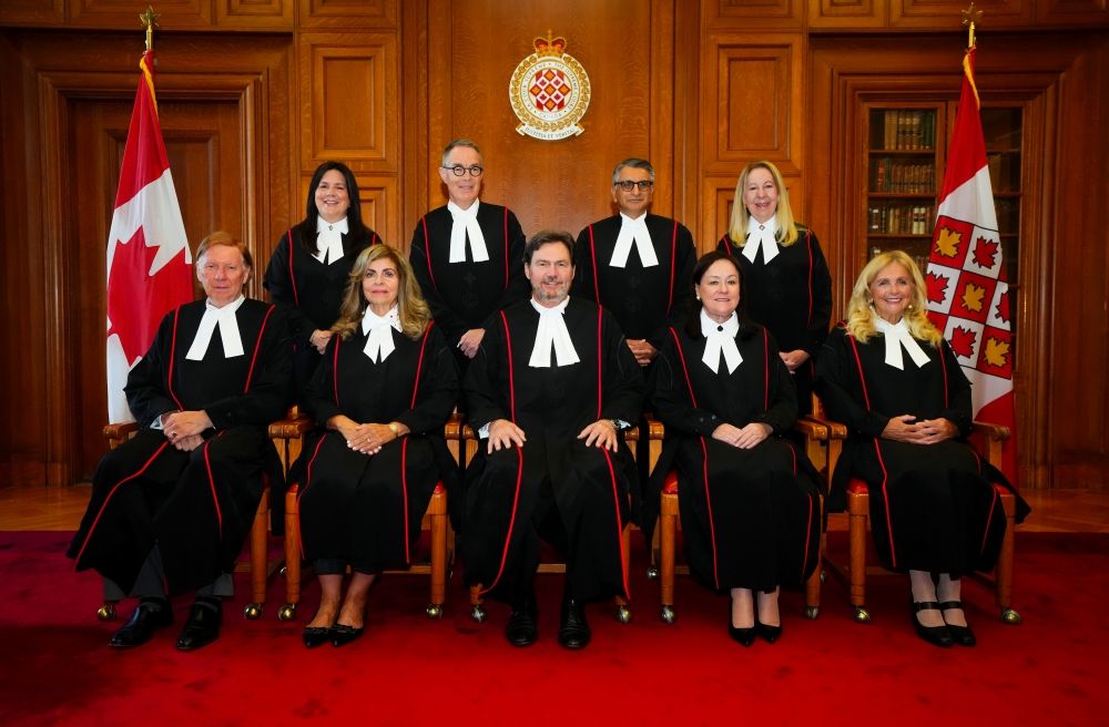 Supreme Court of Canada Justices Malcolm Row, left to right, Michelle O’Bonsawin, Andromache Karakatsanis, Nicholas Kasirer, Richard Wagner, Mahmud Jamal, Suzanne Cote, Mary T. Moreau, and Sheilah L. Martin wear their new robes as they take part in the Official Bench Photo in the Judges’ Conference Room at the Supreme Court of Canada in Ottawa on Monday, Oct. 6, 2025.