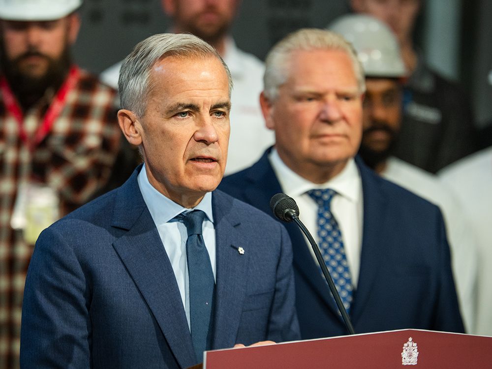 Prime Minister Mark Carney, left, makes an announcement with Ontario Premier Doug Ford at the Darlington Energy Complex in Courtice, Ont., on Thursday, October 23, 2025.  Prime Minister Mark Carney, left, makes an announcement with Ontario Premier Doug Ford at the Darlington Energy Complex in Courtice, Ont., on Thursday, October 23, 2025.