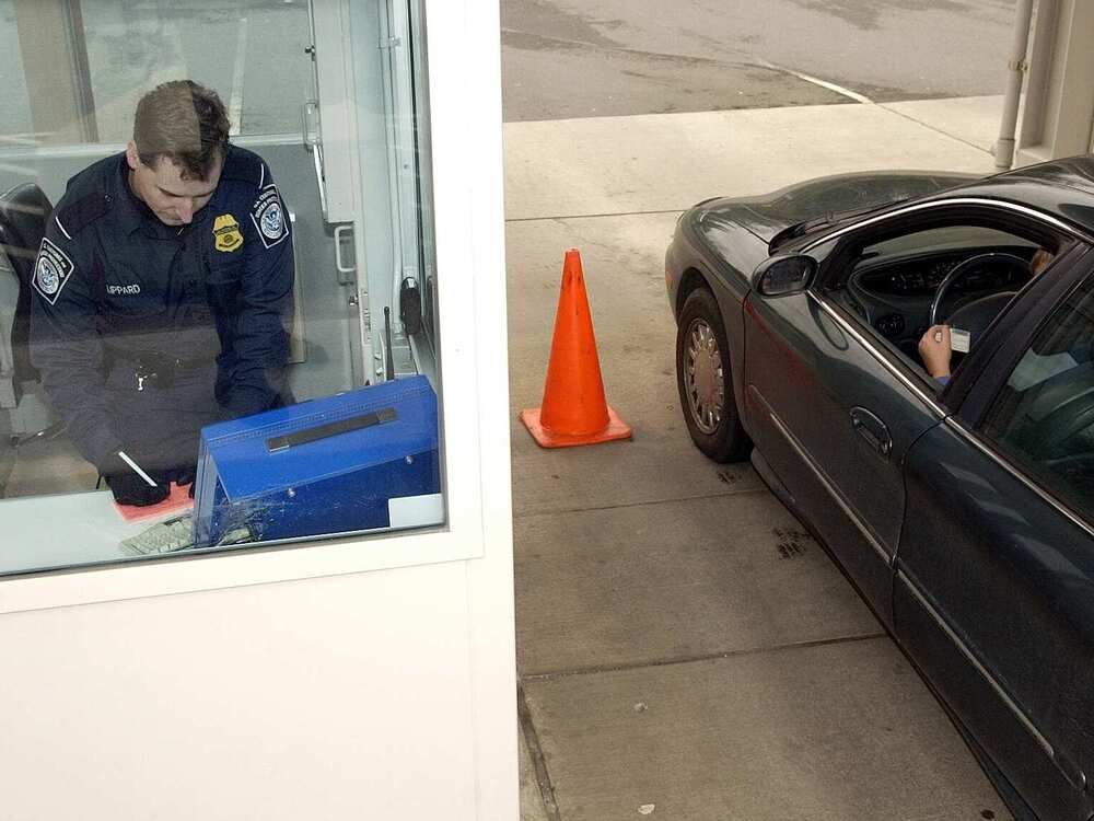 A visitor to the United States goes through the US-VISIT biometric entry procedure at a land crossing in Washington in 2004.  A visitor to the United States goes through the US-VISIT biometric entry procedure at a land crossing in Washington in 2004.
