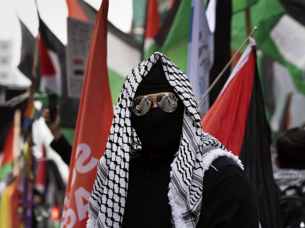  Hamas supporters protest in front of the Israeli Consulate in Toronto as people with Israel Now counter-protest, Thursday, June 5, 2025.