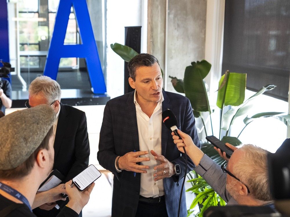 Minister of AI and Digital Innovation Evan Solomon speaks to media following an announcement during a visit to Scale AI, in Montreal on Thursday, July 10, 2025.