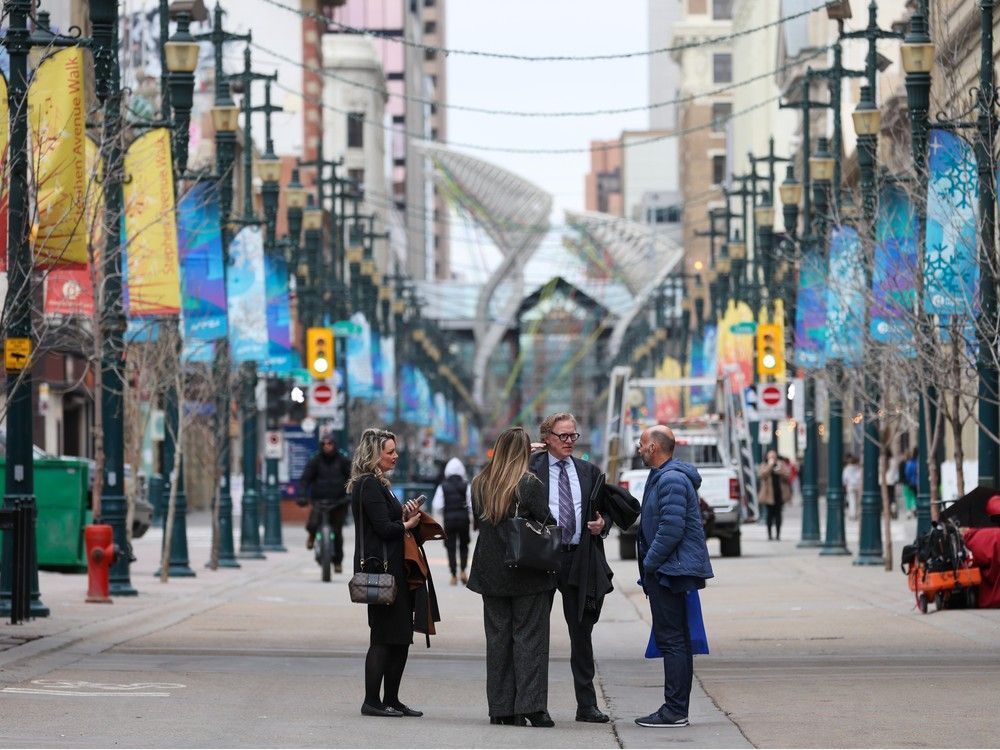 Downtown Calgary workers talk on Stephen Avenue Mall in March. Alberta gained 42,000 jobs in September, leading the country in job gains. Downtown Calgary workers talk on Stephen Avenue Mall in March. Alberta gained 42,000 jobs in September, leading the country in job gains.
