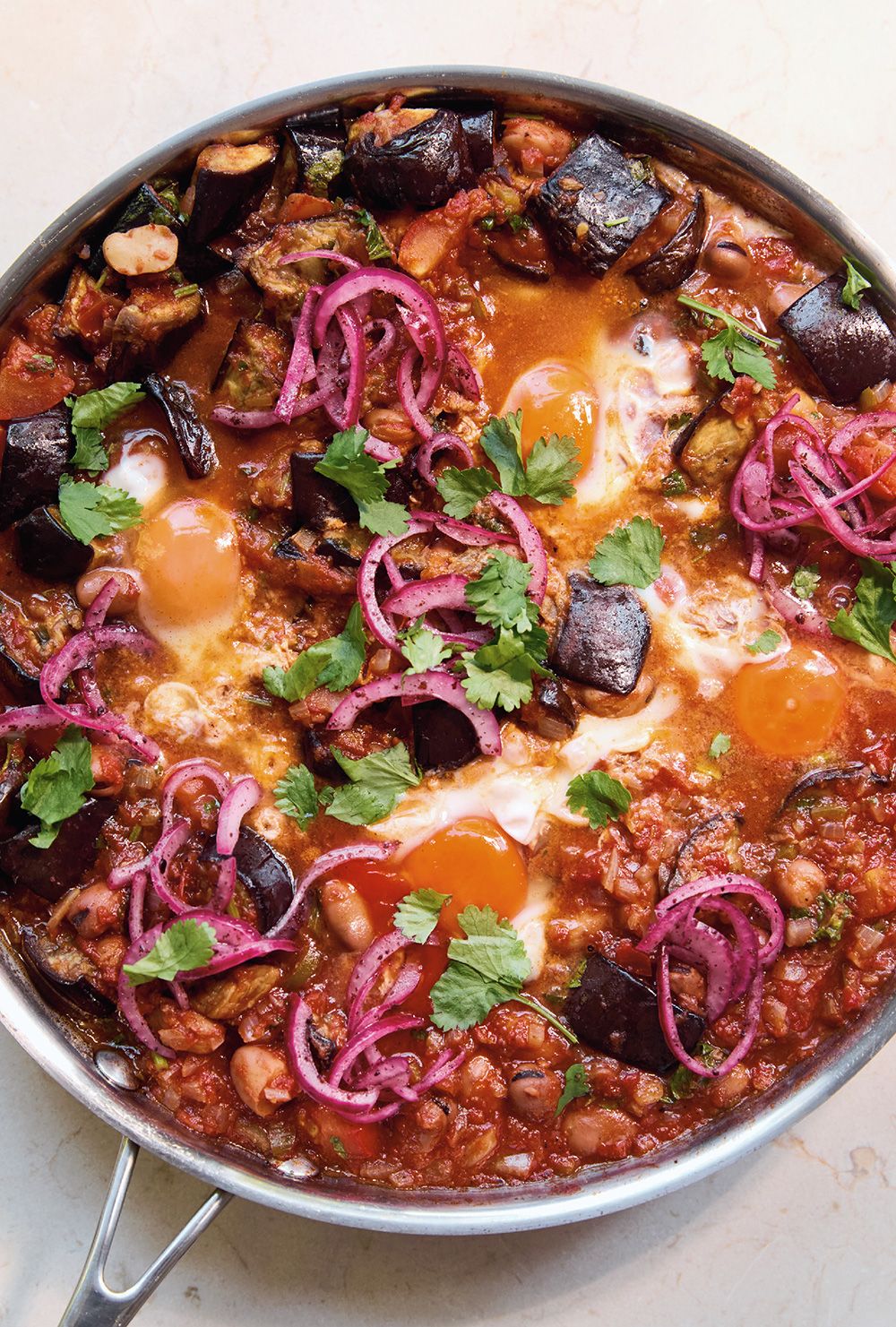 “It has all the beautiful flavours that I want from a dish, which is slightly creamy, spicy, sweet, salty. It all comes in one dish,” Sami Tamimi says of his eggplant and fava beans with eggs.
