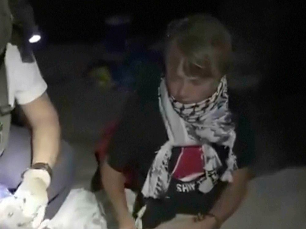 This image taken from video released by the Israeli Foreign Ministry shows activist Greta Thunberg as she is removed after the Israeli navy intercepted the Global Sumud Flotilla carrying humanitarian aid towards Gaza on Oct. 1, 2025. This image taken from video released by the Israeli Foreign Ministry shows activist Greta Thunberg as she is removed after the Israeli navy intercepted the Global Sumud Flotilla carrying humanitarian aid towards Gaza on Oct. 1, 2025.
