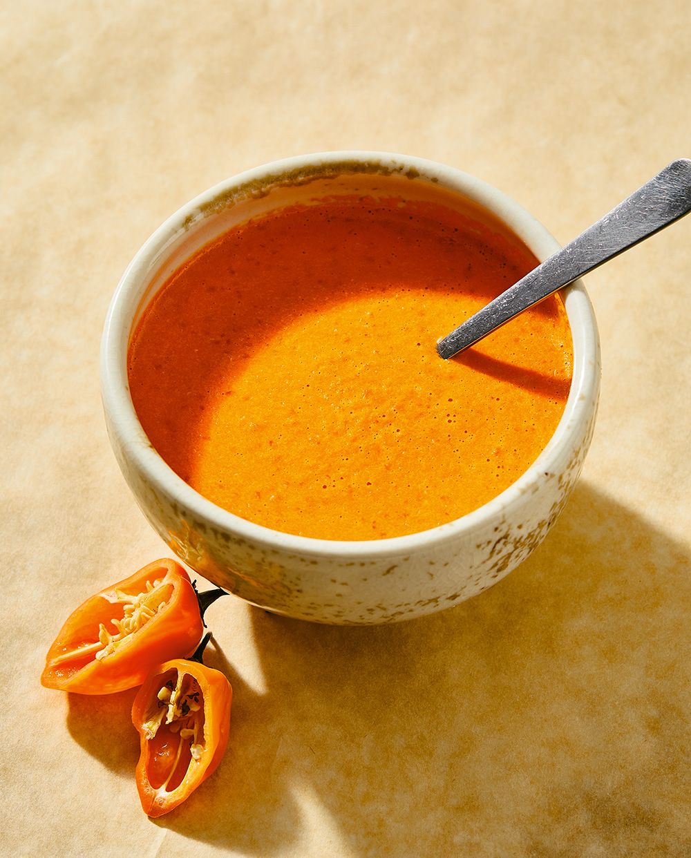 “A little goes a long way,” Hawa Hassan says of pili pili, a hot sauce made with Scotch bonnet chilies from the Democratic Republic of Congo.  “A little goes a long way,” Hawa Hassan says of pili pili, a hot sauce made with Scotch bonnet chilies from the Democratic Republic of Congo.