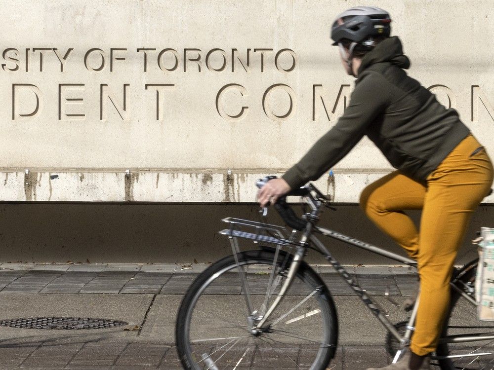 A cyclist rides past the University of Toronto Student Commons building, Tuesday November 7, 2023. A cyclist rides past the University of Toronto Student Commons building, Tuesday November 7, 2023.