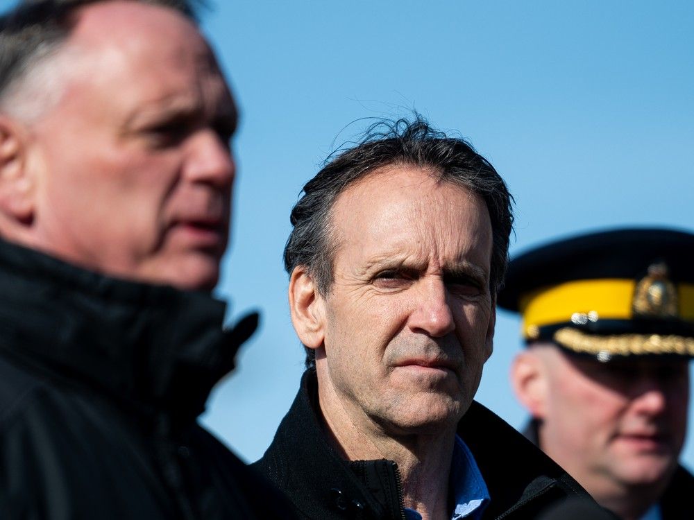  Canada’s fentanyl czar Kevin Brosseau, centre, looks on as Minister of Public Safety David McGuinty, left, speaks during a press conference following a tour of the Canada Border Services Agency Lansdowne port of entry in Lansdowne, Ont., on Wednesday, Feb. 12, 2025.
