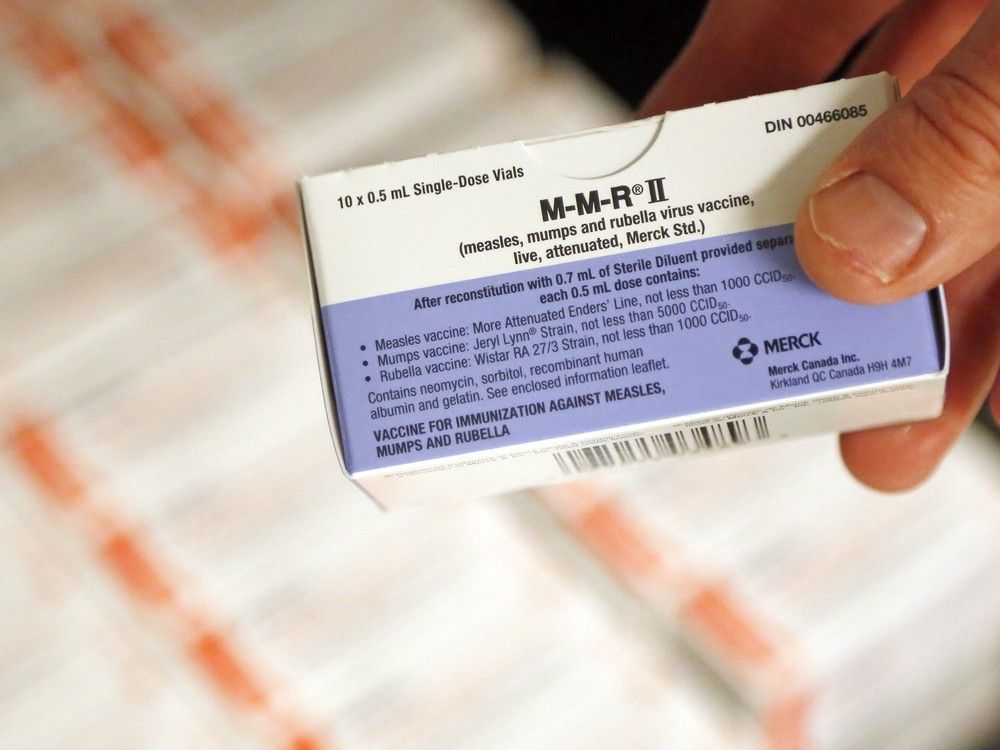  A public health official holds a box of the combined vaccine for measles, mumps, and rubella Friday, March 22, 2019 at Hastings Prince Edward Public Health in Belleville.