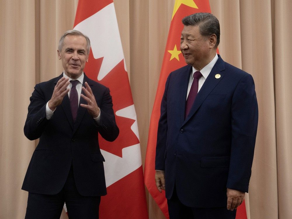  Canadian Prime Minister Mark Carney, left, meets Chinese President Xi Jinping at the start of a meeting in Gyeongju on Friday, Oct. 31, 2025.