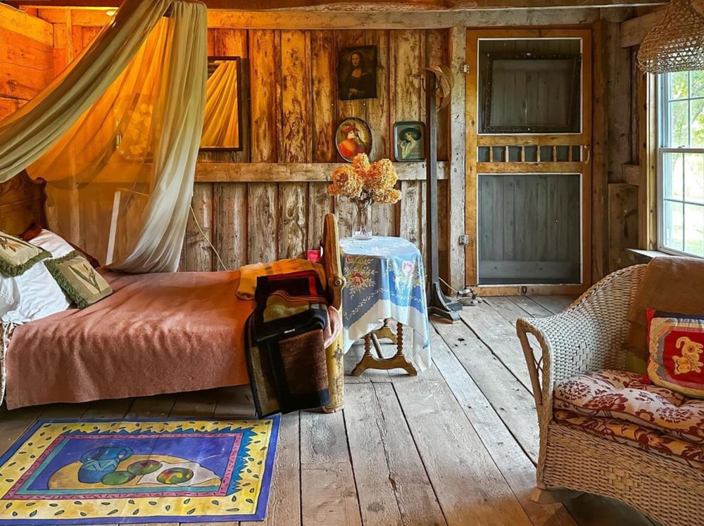  A two-storey barn includes a cottage room overlooking the garden.