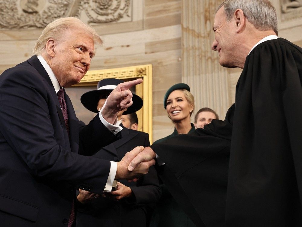 US President Donald Trump shakes hands with US Supreme Court Chief Justice John Roberts after he was sworn in during inauguration ceremonies in the Rotunda of the US Capitol on January 20, 2025 in Washington, DC. US President Donald Trump shakes hands with US Supreme Court Chief Justice John Roberts after he was sworn in during inauguration ceremonies in the Rotunda of the US Capitol on January 20, 2025 in Washington, DC.
