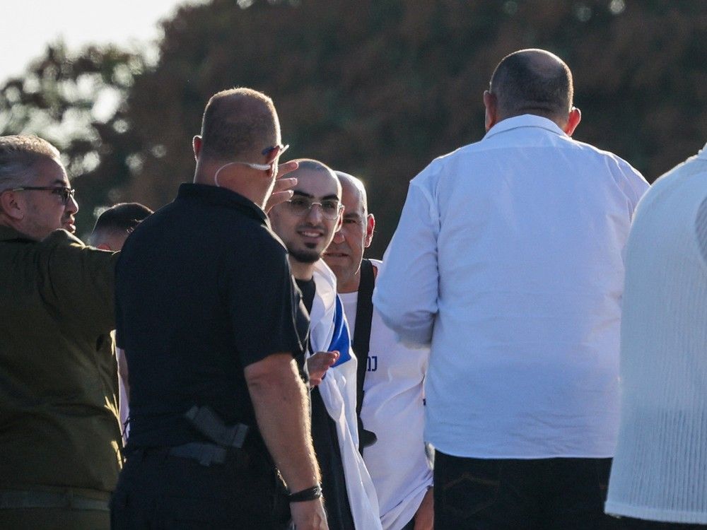  Israeli soldiers accompany Rom Braslavski, formerly held hostage in Gaza since October 2023 by Palestinian terrorists, upon his arrival at the Sheba Tel-HaShomer Medical Centre in Ramat Gan on October 13, 2025.
