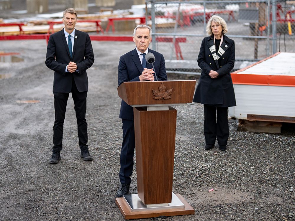  Prime Minister Mark Carney makes a major projects announcement along with Infrastructure Minister Gregor Robertson, left, and CEO of the federal Major Projects Office Dawn Farrell, in Terrace, B.C., on Thursday, November 13, 2025.