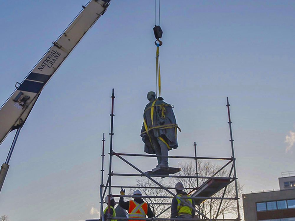  A statue of Edward Cornwallis is hoisted to be taken away from the Halifax park that bore his name at the time, Jan. 31, 2018.